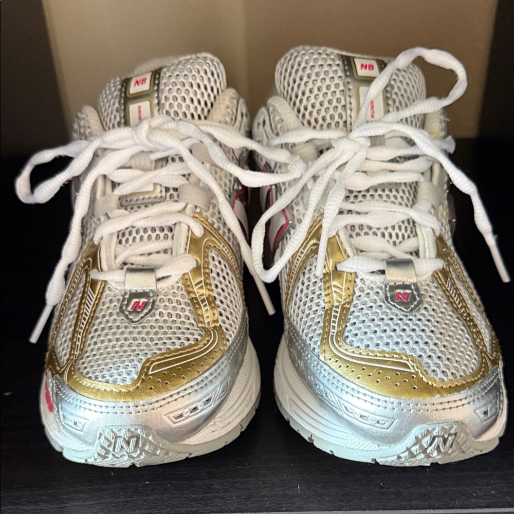 New Balance White Mesh Sneakers with Gold Overlays and Pink Accents
